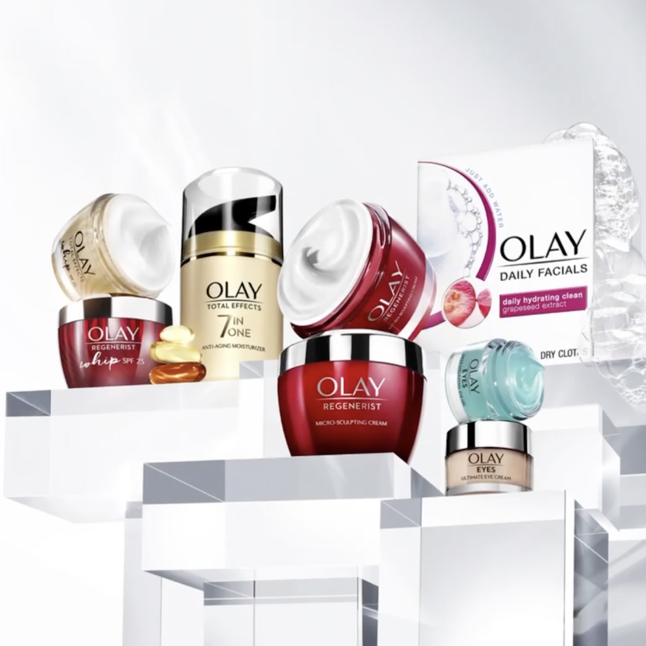Olay skincare range on glass plinths